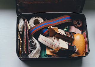 a storage bin with a jumble of items