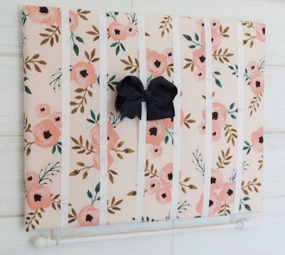 bow and headband holder — ribbons on a flower-patterned fabric backing