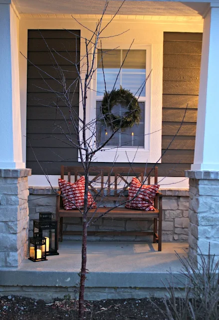 Simple wood bench and lanterns on porch