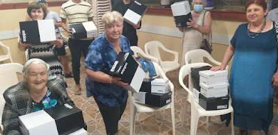Holocaust Survivors in Beer Sheva receiving gift of sport shoes from Israel Relief Aid
