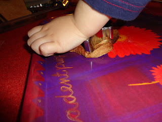 Big Boy using a cookie cutter to make a Toast Christmas Decoration