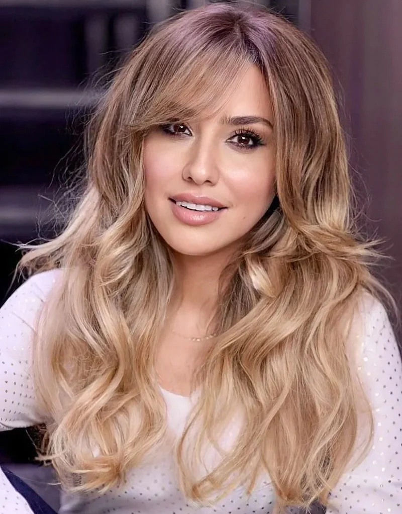 portrait of a beautiful woman with wispy bangs and styled hair