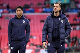 Jude Bellingham and Jordan Henderson of England