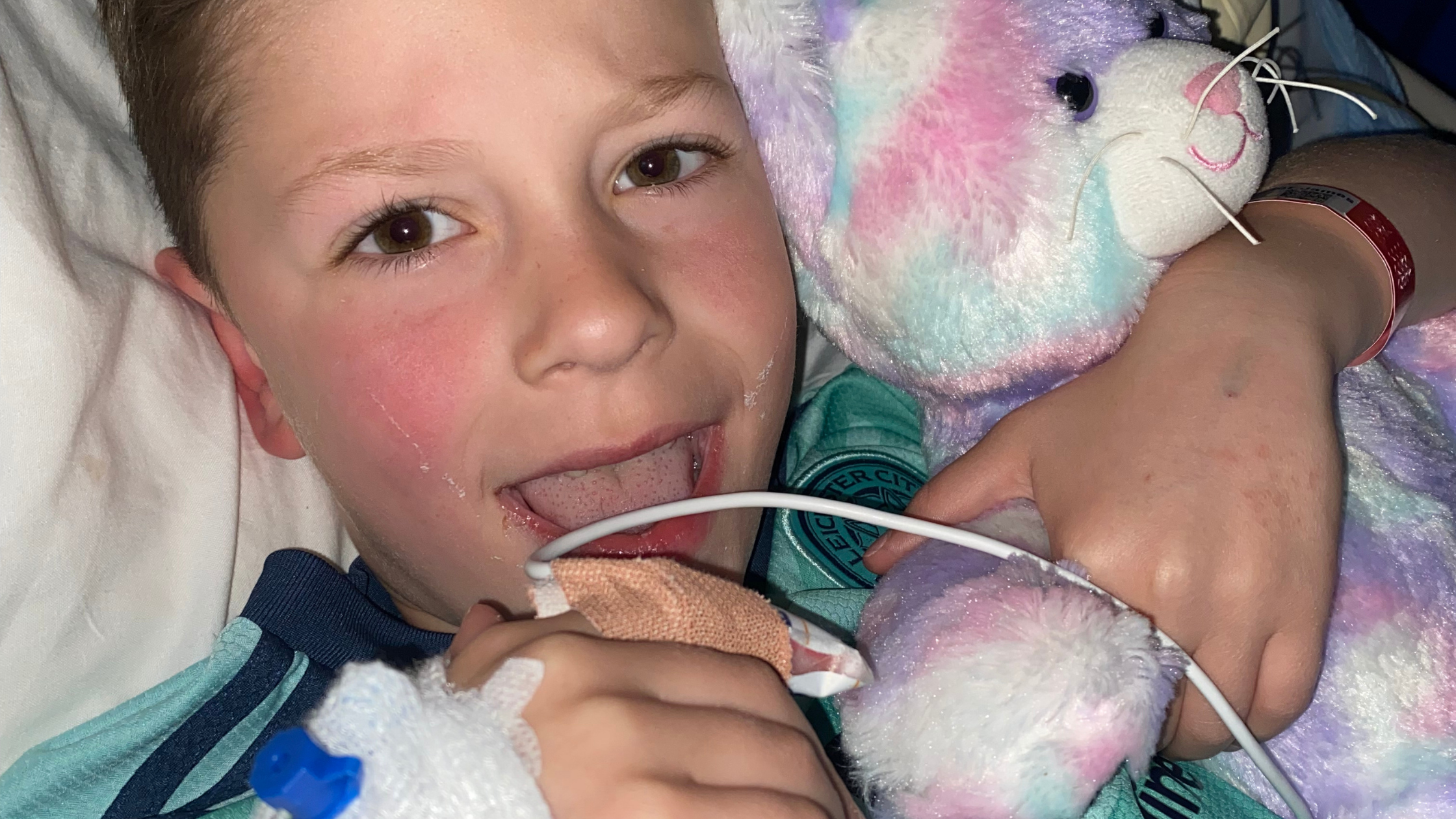 Boy with cuddly toy in hospital