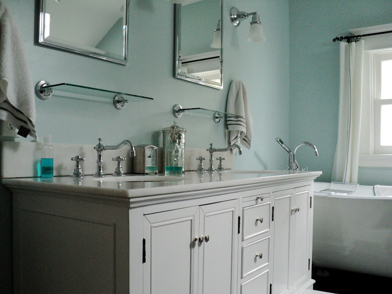 the double sink vanity provides storage i love how the title=