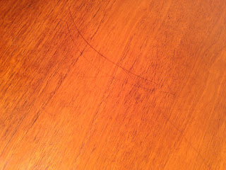 Some surface scratching - Surface marks to dining table