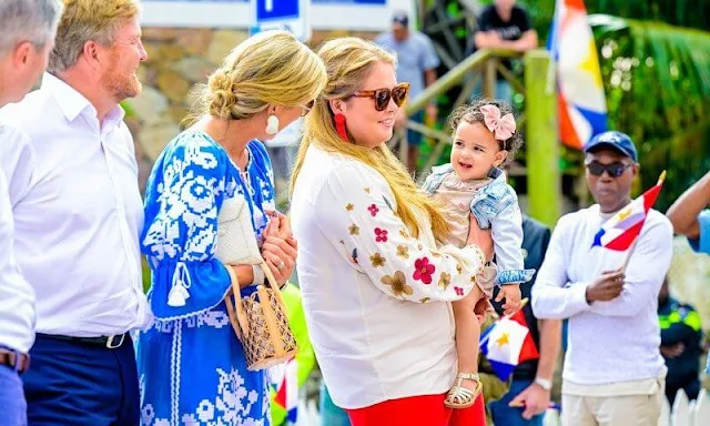 Queen Maxima wore an ocean dress by Foberini. Princess Amalia wore Heidi floral pattern blouse by Fabienne Chapot