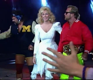 NWA Wrestlewar 1989 - Missy Hyatt leads Eddie Gilbert and Rick Steiner to the ring 