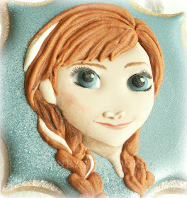 Finished handpainted decorated cookie of Anna from Disney's Frozen, by Honeycat Cookies