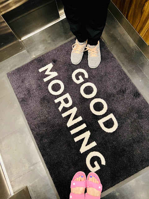 A shoe shot with the Good Morning Rug at the Godfrey Hotel Boston.