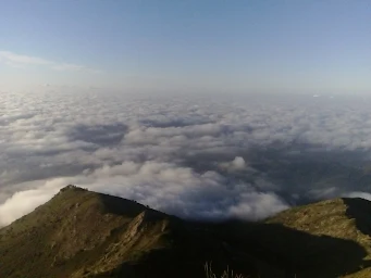 Top of a mountain, over the clouds