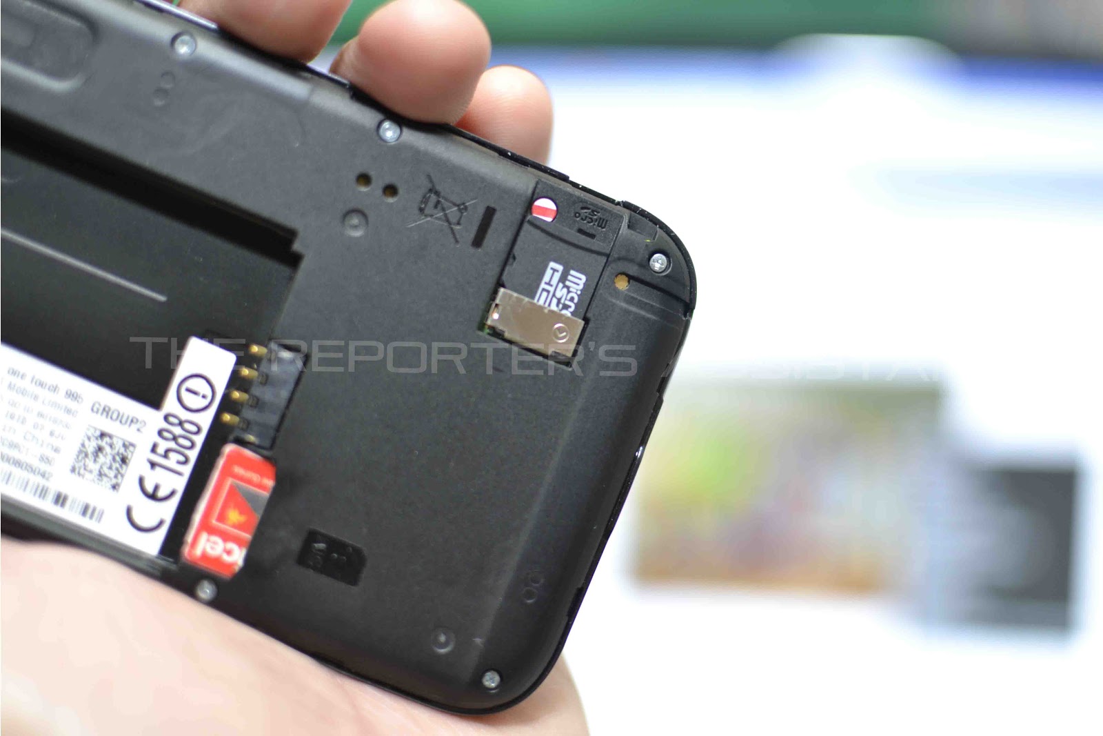 The SIM card is located below the battery compartment and micro-SD ...