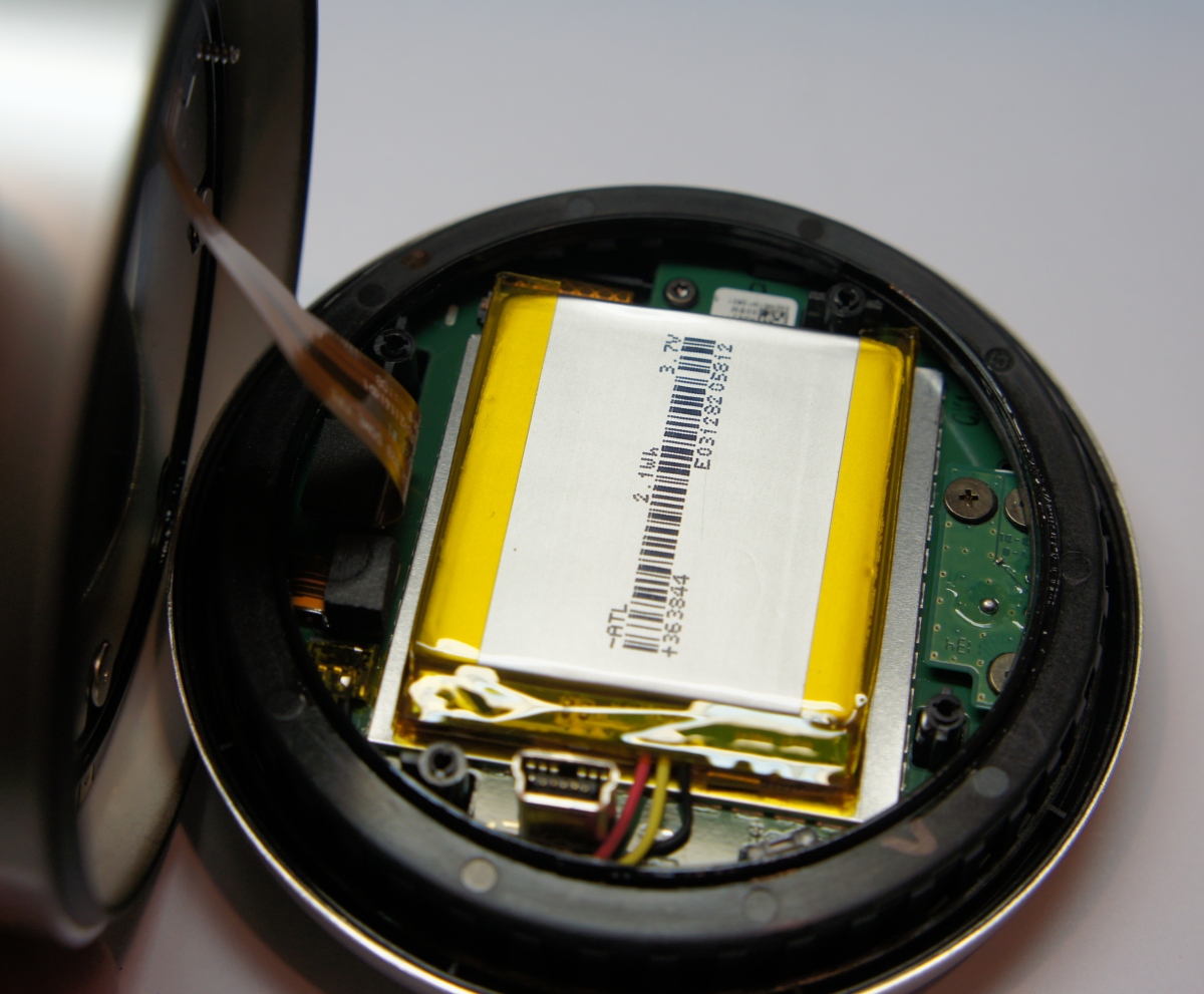 A close-up view of a Nest thermostat with a focus on the battery compartment, illustrating the guide on understanding Nest thermostat batteries.