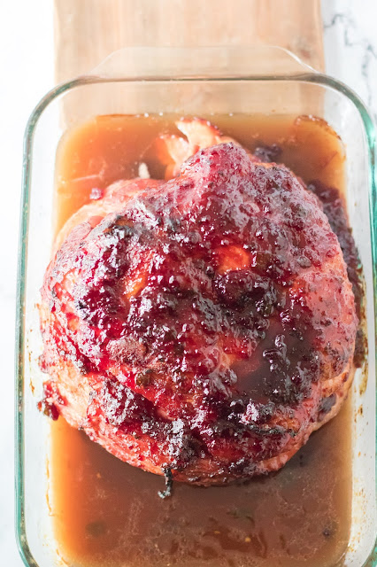 whole ham in a baking dish.