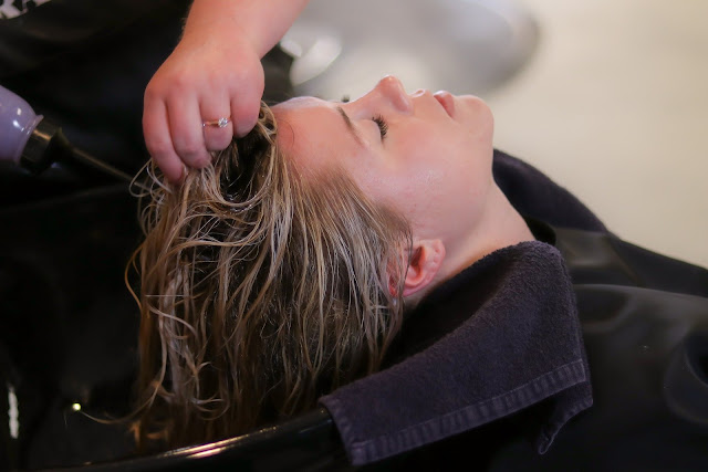 Woman at the Hairdressers having hair washed