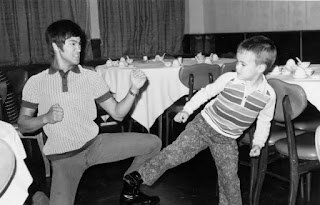 Bruce Lee playing with a kid