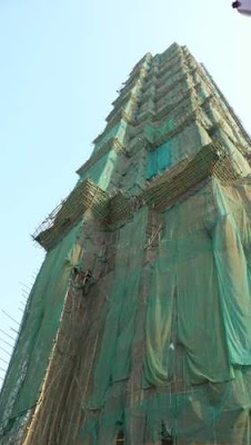 Image of bamboo scaffolding on a residential high rise/skyscraper in Hong Kong.