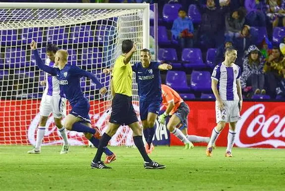 Málaga player Bartłomiej Pawłowski celebrates after scoring the equaliser against Valladolid