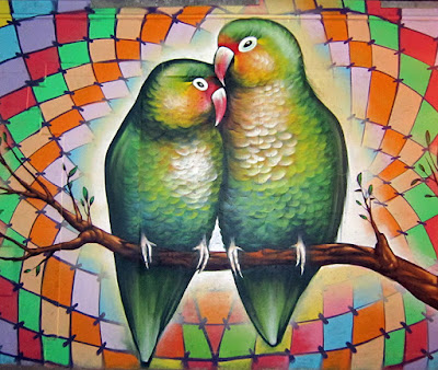 Mural of two green birds snuggling on a branch