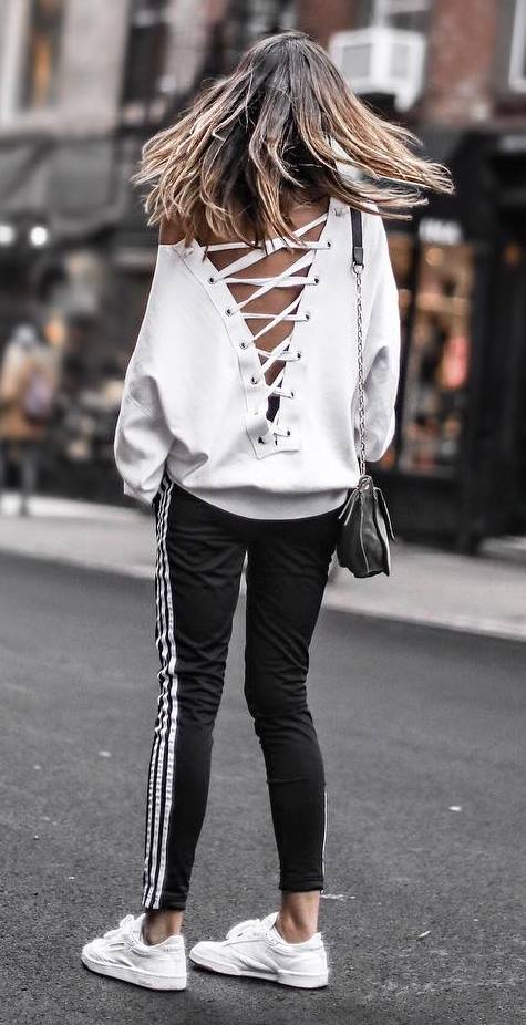cute outfit idea_lace up sweater + bag + stripped pants + sneakers