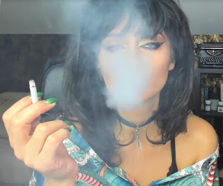Brunette Beauty Lyria Blowing Cigarette Smoke