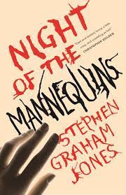A hand reaches to touch roughly-written lettering which reads "Night of the Mannequins"