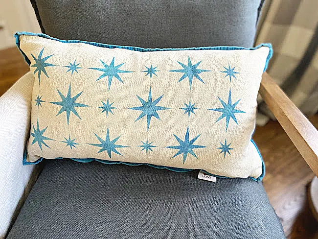 retro star stenciled pillow in chair