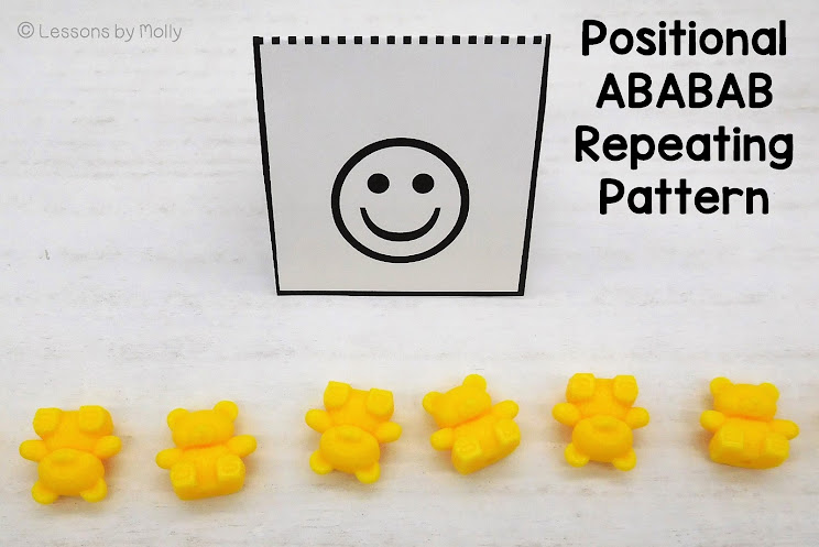 The photo showcases a orientation in space ababab pattern created with yellow bear counters positioned as upside down and right side up. This serves as a great example of an orientation pattern, where the alternating positions of the bears effectively express the ababab pattern.