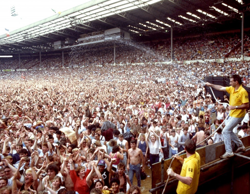 Pictures of Music Fans Attend the 1985 Live Aid Concert at Wembley