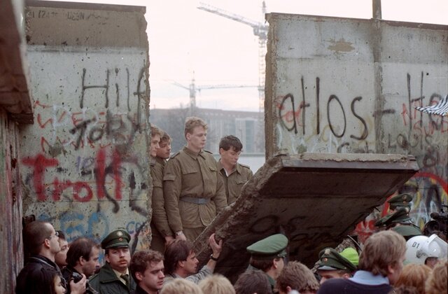 Today in History: Germans begin demolishing the Berlin Wall