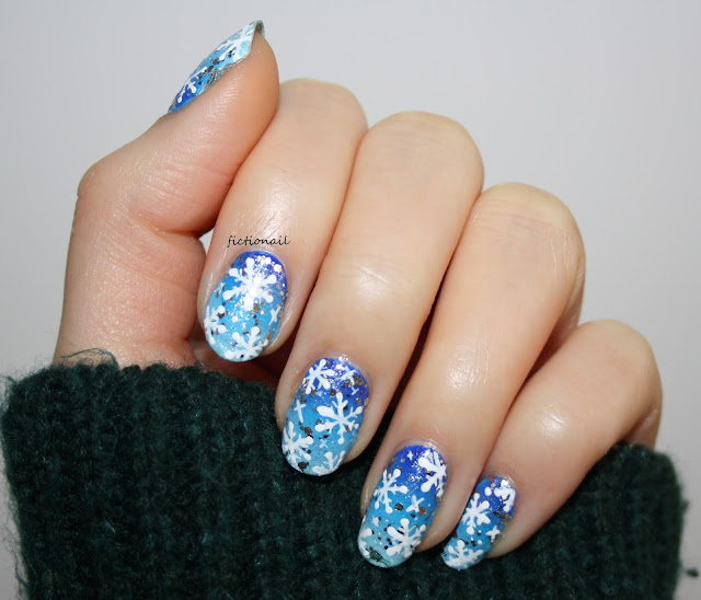 Festive Blue Snowflake Nail Art