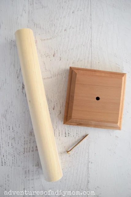 a large wooden dowel, a square finial base and a screw