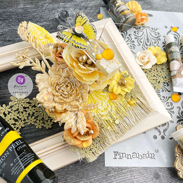 Altered paintbrush in yellow and gold, using Finnabair art mediums and Prima Marketing flowers.