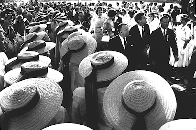 photo of Senator John F Kennedy and his sisters walking with Governor Michael V Di Salle and Governor Abraham A Ribicoff and women in hats,  Los Angeles, CA, 1960