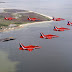 Red Arrows of Royal Air Force Escort USAF F-22 Raptor