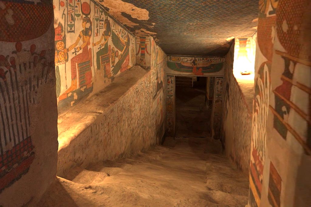 Steps down into the lower section of the tomb. Egyptian paintings on the walls.