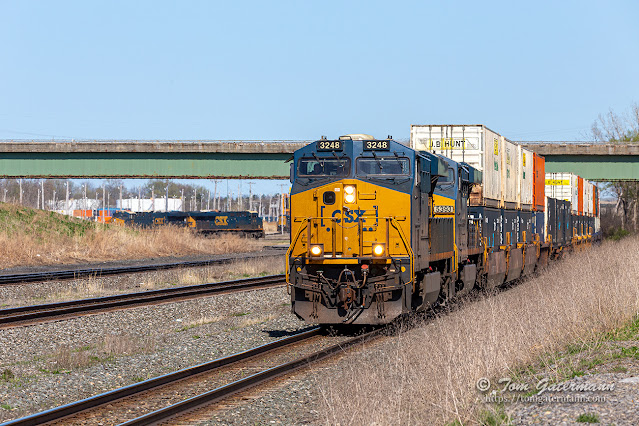 CSXT 3248 and CSXT 5393 lead priority intermodal train I003-30 west on Track 2. Beyond the I-481 overpass are two CSX locomotives sitting on the Middle Connection track.