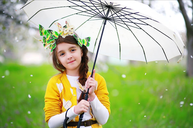 Beautiful Girl Holding a Umbrella