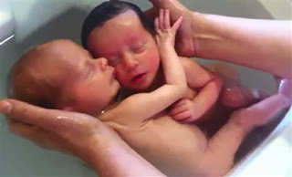 Twins mimic life in the womb