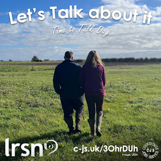 2 people wearing wellington boots walking away from the camera arm in arm in to a grassy field. Text reads: Let's Talk about it