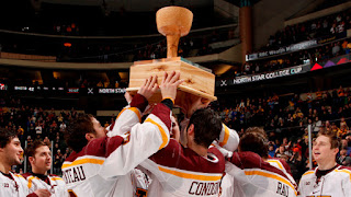 gophers hockey team raising college cup trophy pic courtesy of gopher sports.com