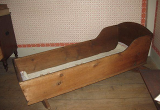 photo of historic adult cradle