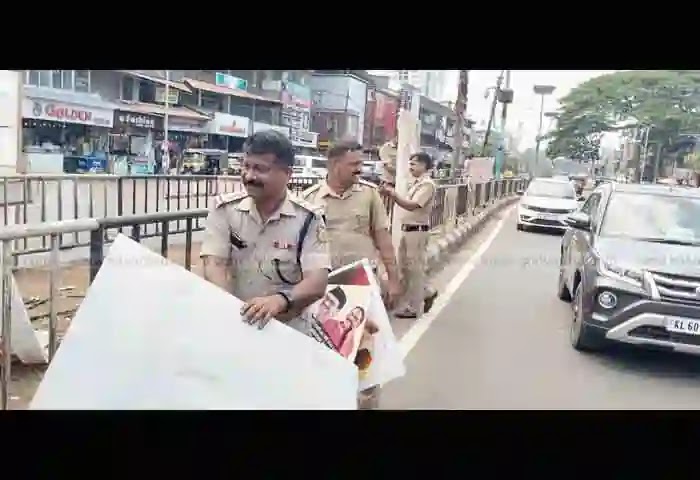 News, Kanhangad, Kasaragod, Kerala, Road, Board, Divider, Illegal boards erected on both sides of road and on divider removed.