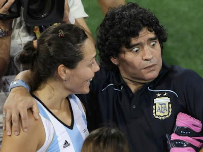 Diego Maradona with a member of the Argentine women's team at the Beijing Olympics.