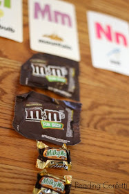 Use leftover Halloween candy as an easy letter recognition activity for preschoolers