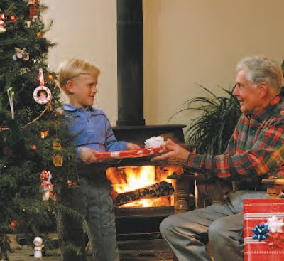 NAMC Montessori christmas seasonal activities reading boy giving gift to grandpa