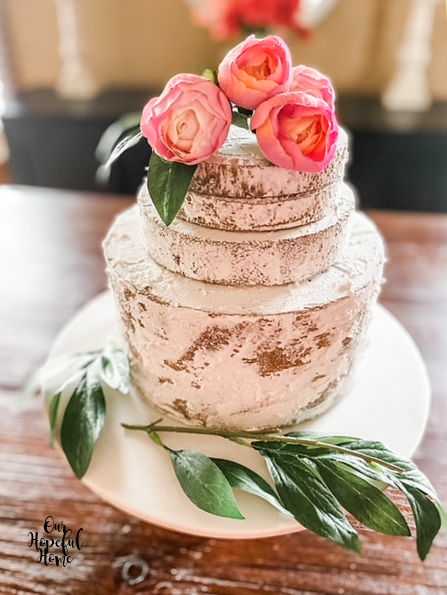 fake naked layer cake white icing pink flowers