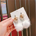 White pom pom earrings