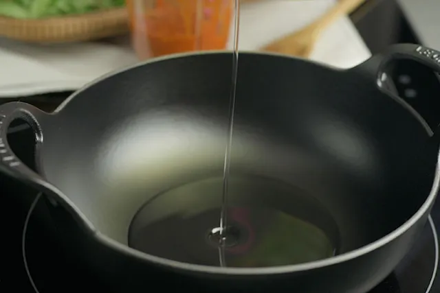 Heat pot and add 1/2 cup of cooking oil.