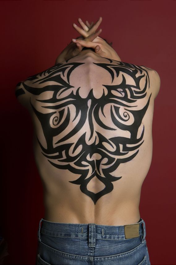 Back Tattoos For Men Tribal. upper back men butterfly